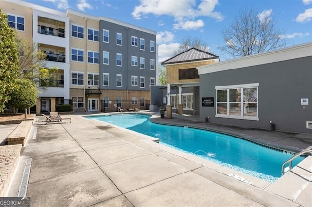 view of pool featuring a patio