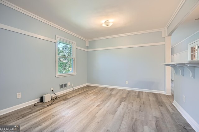 interior space featuring light hardwood / wood-style flooring and ornamental molding