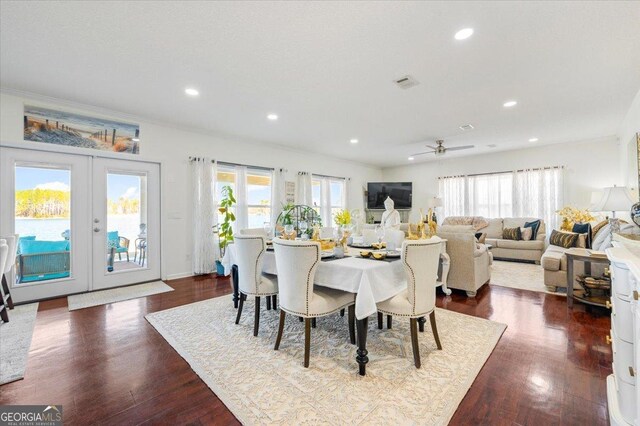 dining space with french doors, ceiling fan, a healthy amount of sunlight, and wood-type flooring