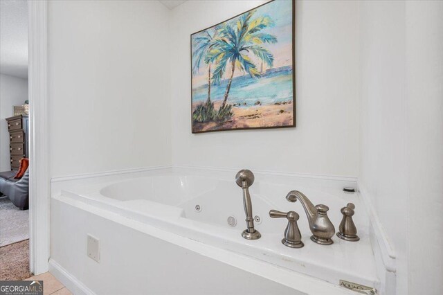 bathroom featuring tile patterned floors and a bathtub