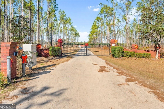 view of street featuring a gate and a gated entry