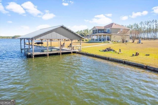 view of dock featuring a yard, a water view, and boat lift