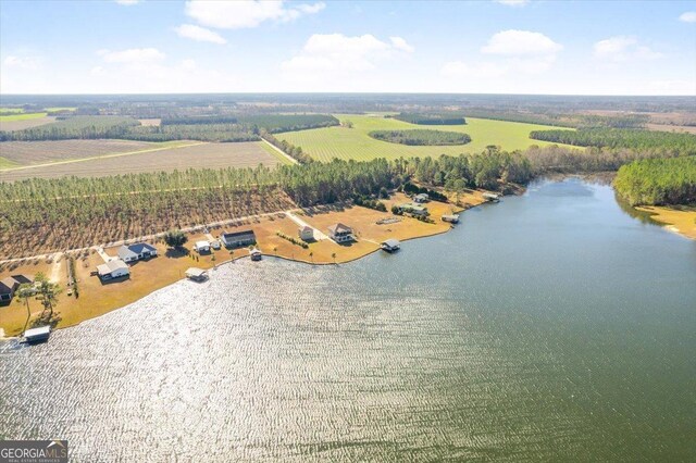 bird's eye view with a water view and a rural view