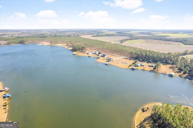 drone / aerial view featuring a water view and a rural view