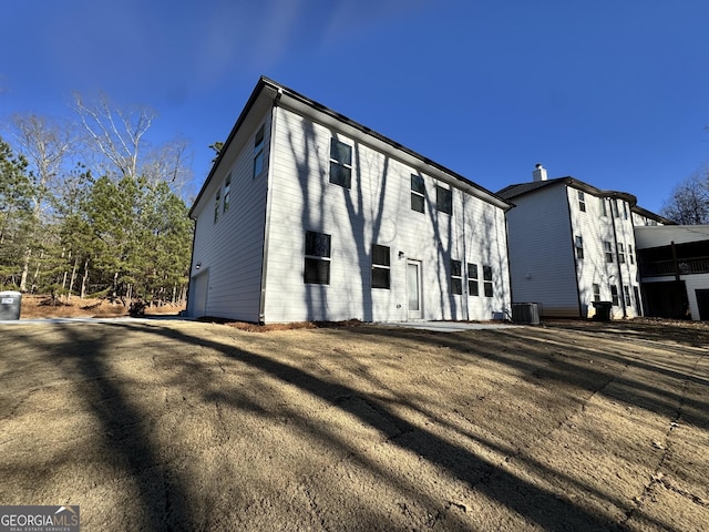 rear view of house with central AC