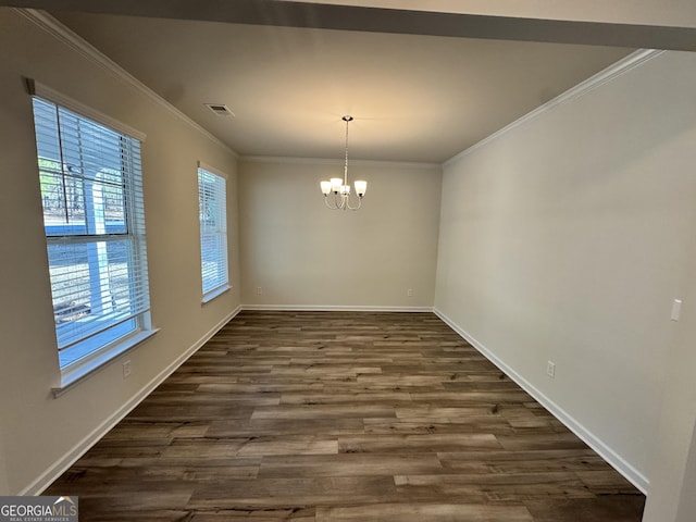 unfurnished dining area with crown molding, dark hardwood / wood-style flooring, and a notable chandelier