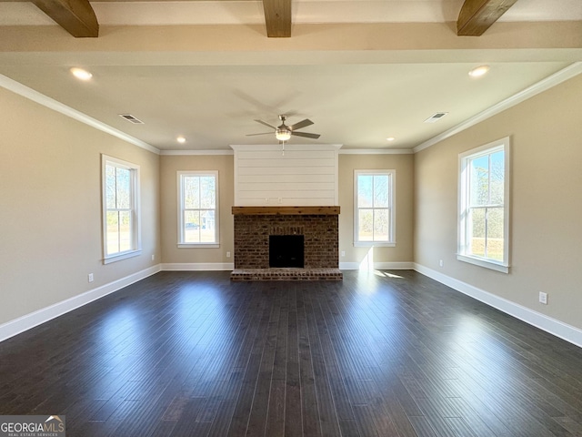 unfurnished living room featuring ceiling fan, beam ceiling, dark hardwood / wood-style flooring, and a brick fireplace