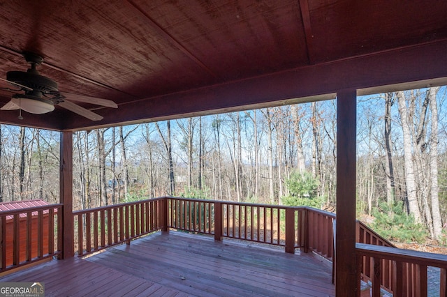 wooden deck featuring ceiling fan