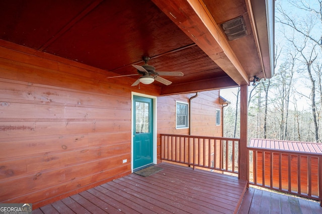 wooden deck with ceiling fan