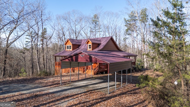 view of side of home featuring a carport