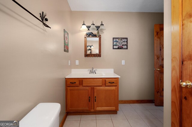 bathroom with tile patterned floors and vanity