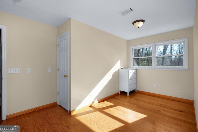 unfurnished room featuring light hardwood / wood-style flooring