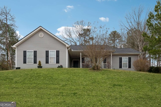 single story home featuring a front lawn