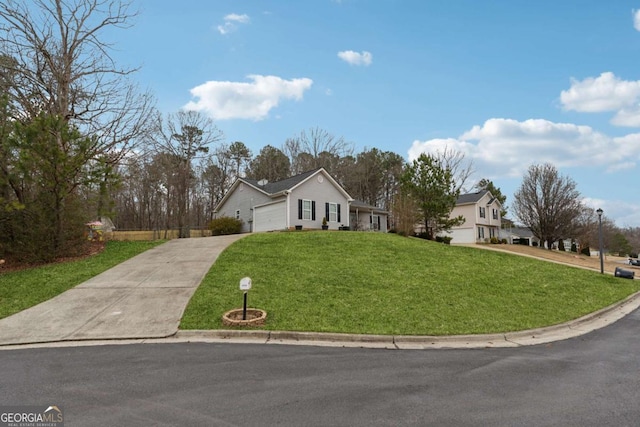 view of front of house with a garage and a front lawn