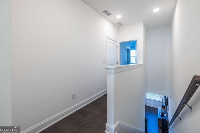 hall with dark hardwood / wood-style floors