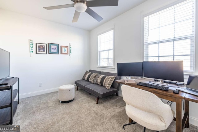 home office with light carpet and ceiling fan