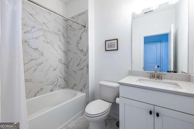 full bathroom with vanity, toilet, and tiled shower / bath