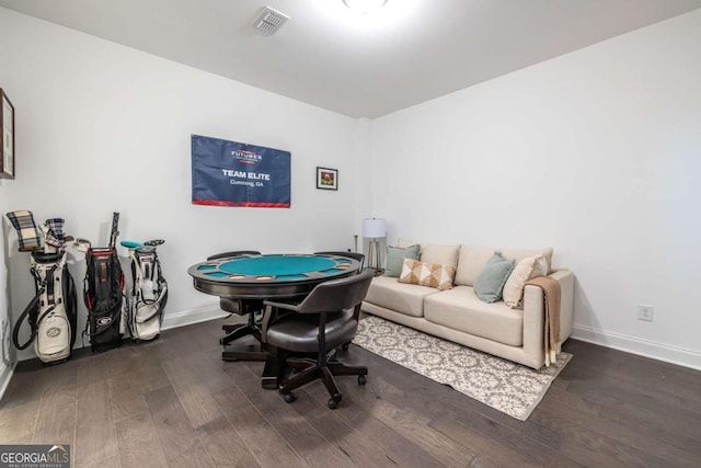 recreation room with dark wood-type flooring