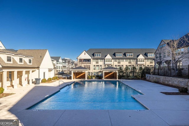 view of swimming pool featuring a gazebo and a patio area