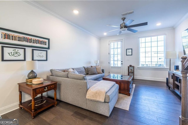 living room with ceiling fan, dark hardwood / wood-style flooring, and ornamental molding