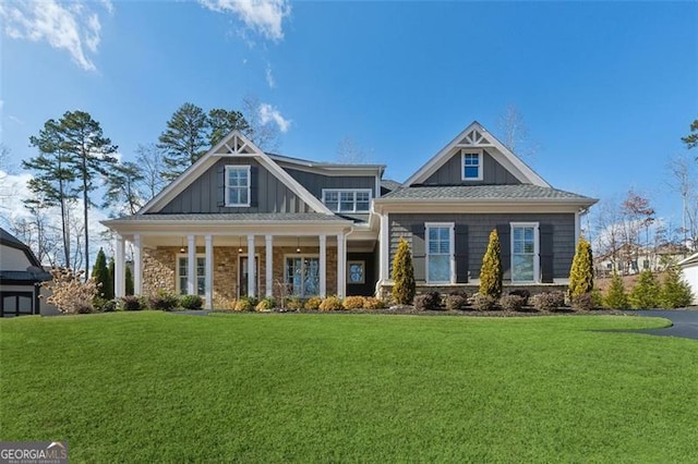 craftsman-style house with a front lawn