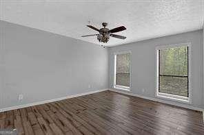 spare room featuring dark hardwood / wood-style flooring