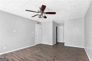 empty room with dark hardwood / wood-style floors