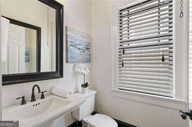 bathroom featuring toilet and sink