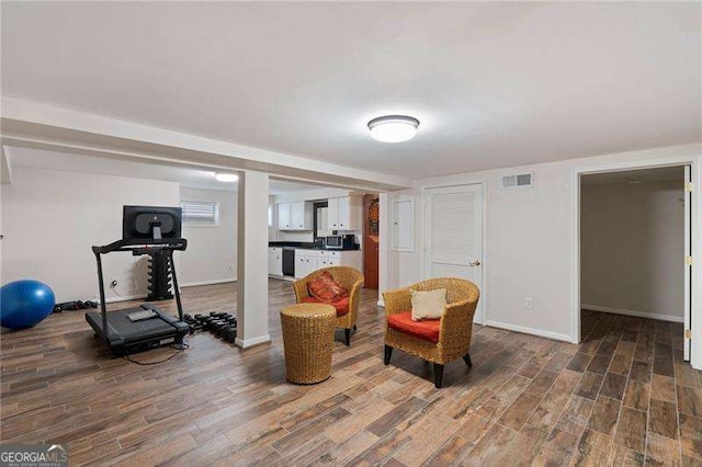 workout room with wood-type flooring