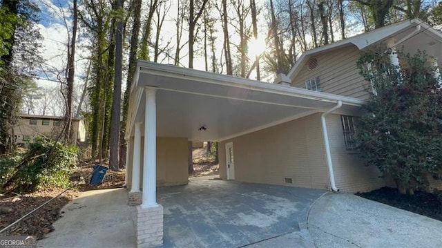 view of home's exterior with a carport