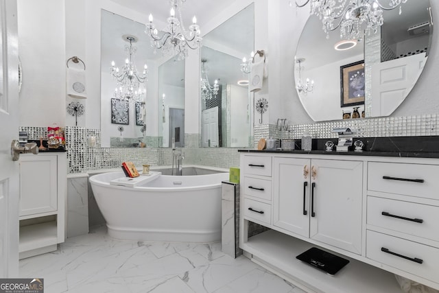 bathroom featuring vanity, a bathtub, and tasteful backsplash