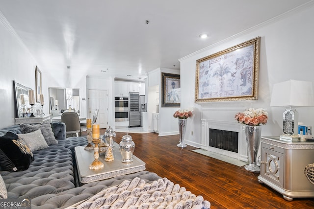 living room with dark hardwood / wood-style floors and ornamental molding