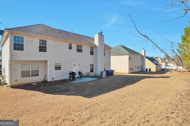 rear view of property with a patio area