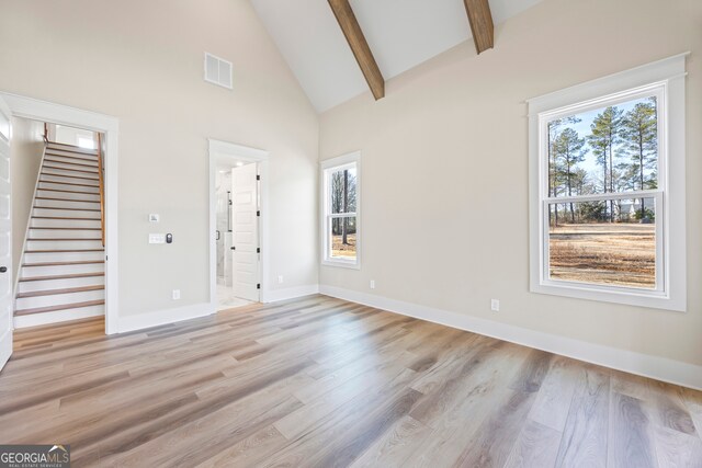 bonus room with ceiling fan, plenty of natural light, and lofted ceiling