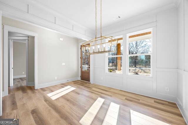 kitchen featuring ceiling fan, light stone countertops, a stone fireplace, beamed ceiling, and high vaulted ceiling