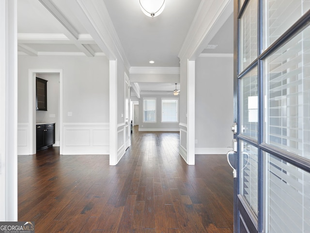 foyer featuring dark hardwood / wood-style floors, crown molding, beamed ceiling, and coffered ceiling