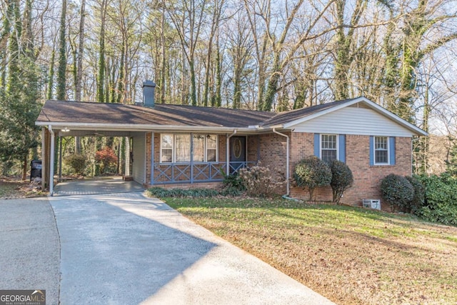 single story home featuring a carport and a front lawn