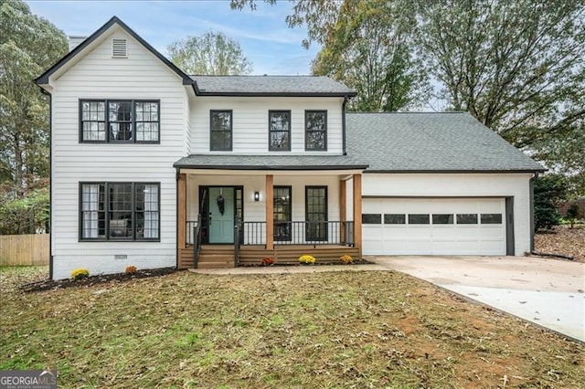 view of front facade featuring a front lawn, covered porch, and a garage