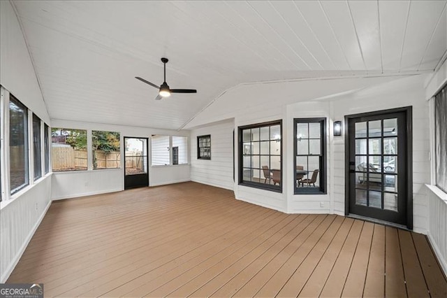 unfurnished sunroom featuring ceiling fan and lofted ceiling