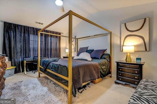 carpeted bedroom featuring ceiling fan and vaulted ceiling