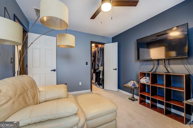 living room featuring ceiling fan and carpet flooring