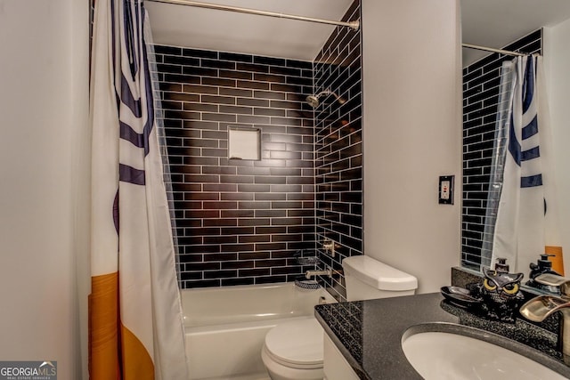 full bathroom featuring vanity, shower / bath combination with curtain, and toilet