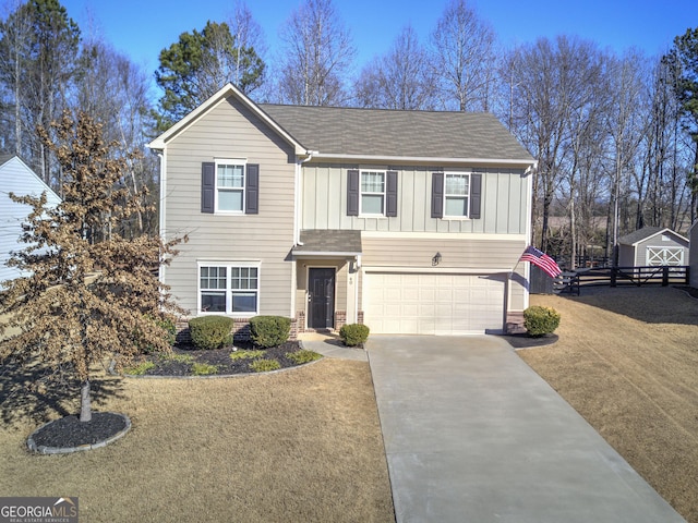 view of front of home featuring a front yard and a garage