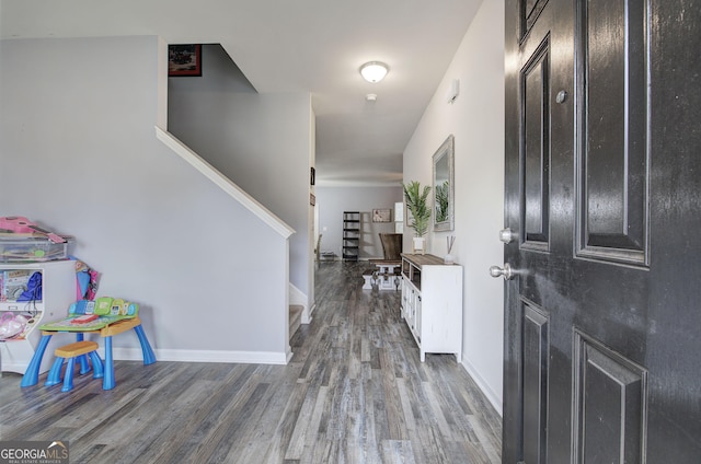 foyer entrance with dark wood-type flooring