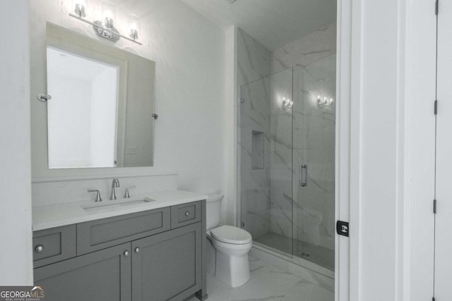 bathroom featuring vanity, toilet, and walk in shower