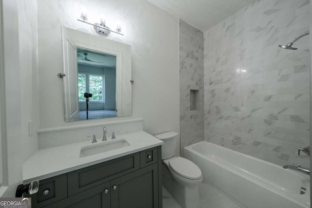 full bathroom with vanity, toilet, and tiled shower / bath