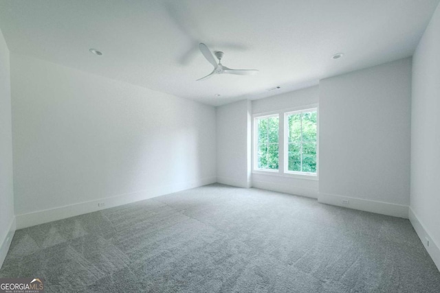 empty room with carpet and ceiling fan