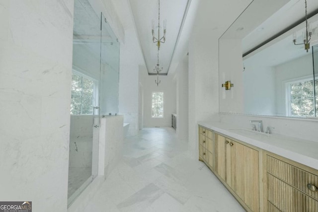 bathroom featuring shower with separate bathtub and vanity