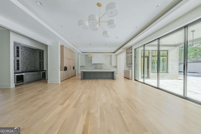 unfurnished living room with light hardwood / wood-style floors