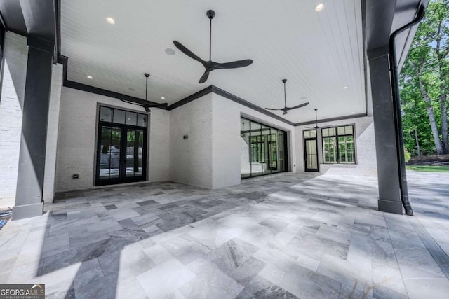 view of patio / terrace featuring ceiling fan and french doors